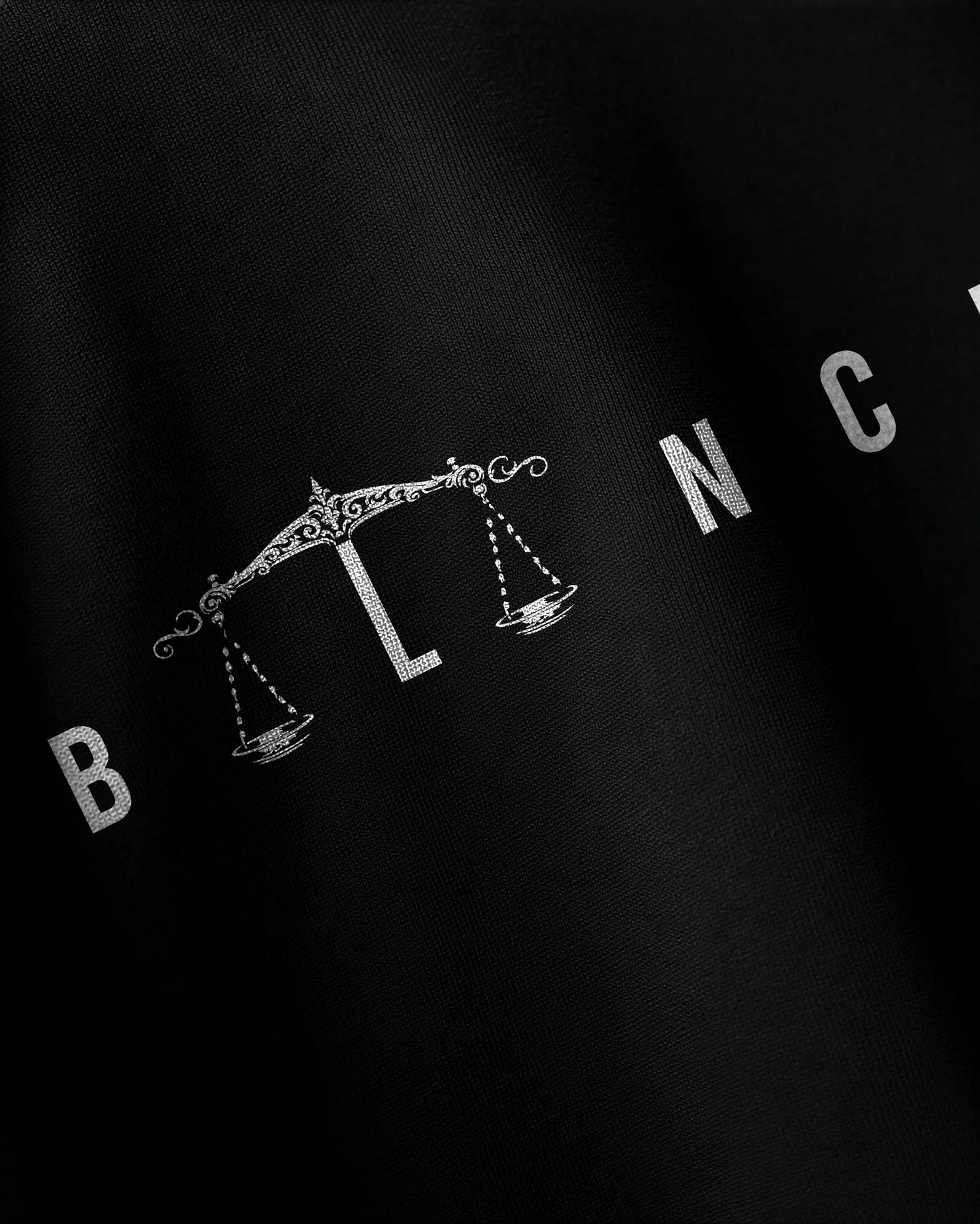 Close-up balance graphic print detail on Equilibrium oversized t-shirt by VDesignzDrop